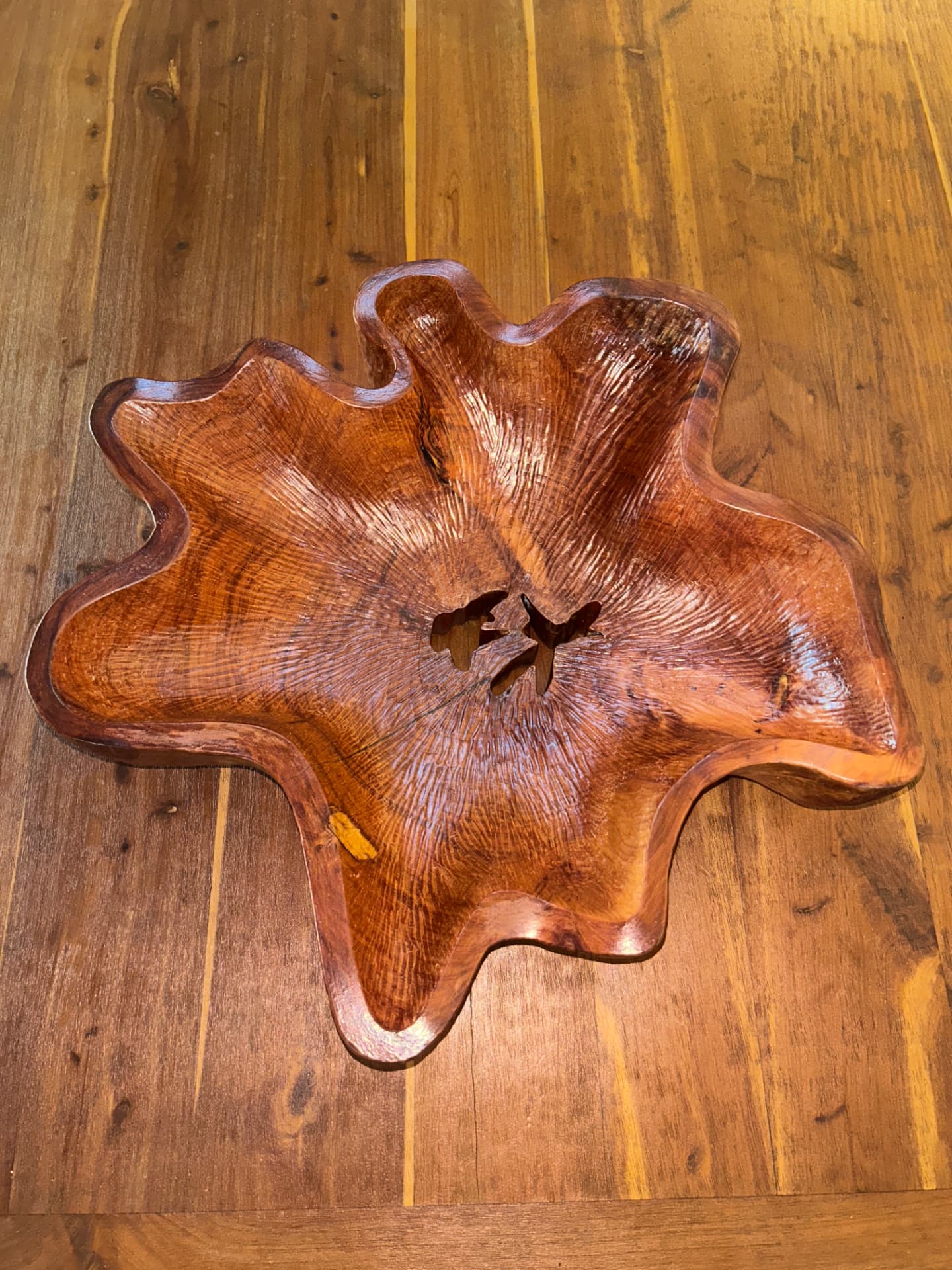 Hand-carved star-shaped wooden bowl with visible grain